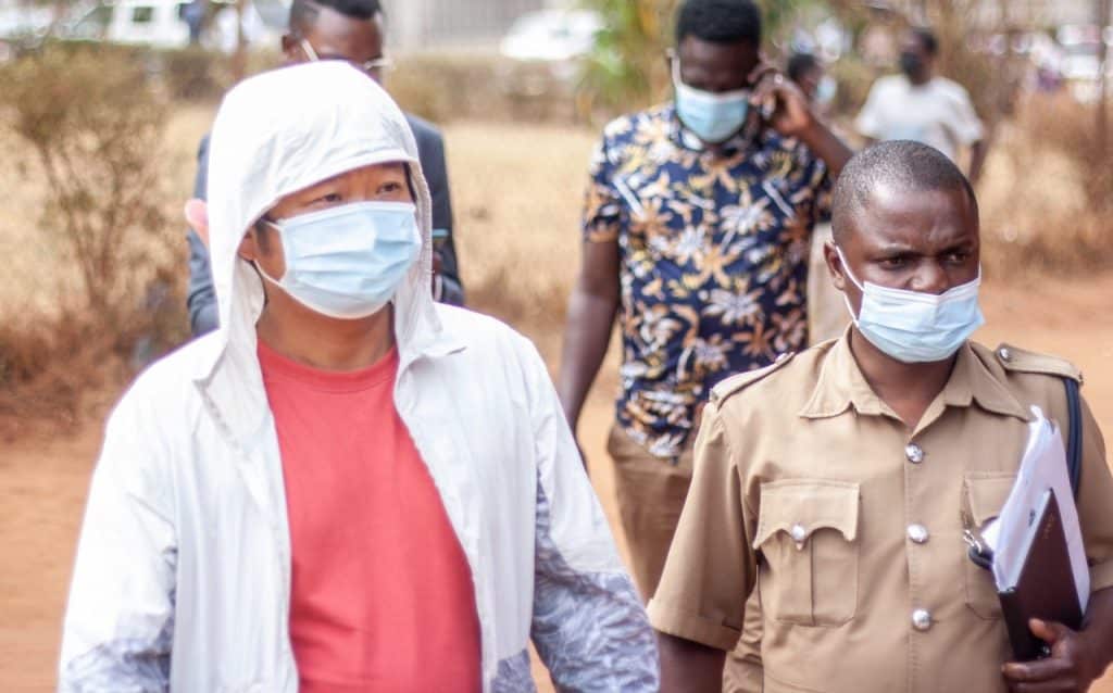 3 - MW Yunhua-Lin-left-at-the-court-in-Malawi-28-Sept-2021 CREDIT TBC